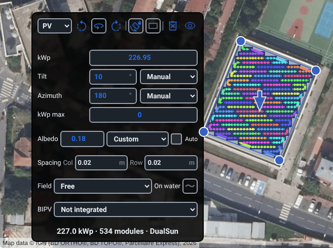 A dark card floating on the aerial photograph beside a roof packed with modules. Its header holds the PV type selector and icon buttons; below are rows for kWp, tilt and its source, azimuth and its source, kWp max, albedo, column and row spacing, field geometry, on water and BIPV, then the line 227.0 kWp, 534 modules.